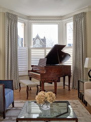 Curtains with piano in bay window