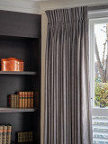 Double pleat curtain on a covered lath