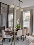 Double pleat curtains hanging from a covered lath