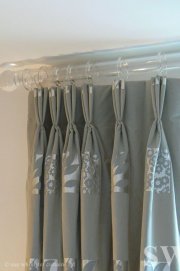 triple pleat curtains from perspex pole