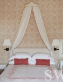 bed curtains with bobvle detail from painted wooden corona