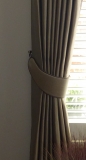 Crescent shaped tie-backs