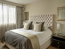 Bedroom Curtains with sheers, headboard with cushions and bedthrow