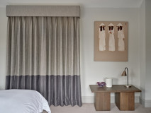 Curtains hanging from upholstered pelmet