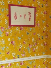 Picture on floral wallpaper