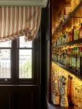 Roman next to drinks bar