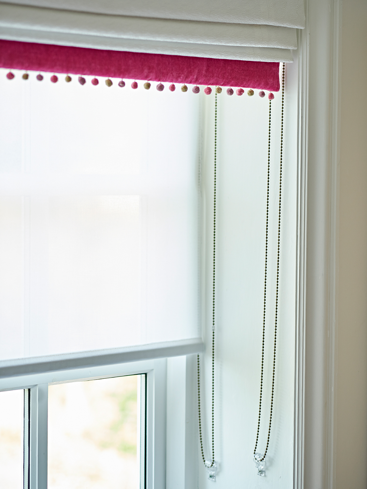 Roman blind with pom poms, and chain system